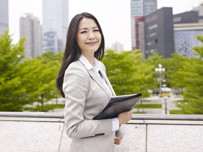 Outdoor portrait of an asian businesswoman. Outdoor portrait of an asian businesswoman.