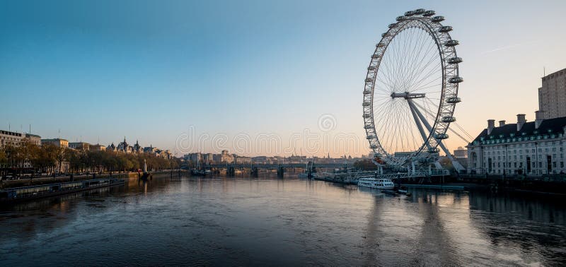 View to London Eye and Thames river from Westminster Bridge early in the morning, Great Britain. View to London Eye and Thames river from Westminster Bridge early in the morning, Great Britain