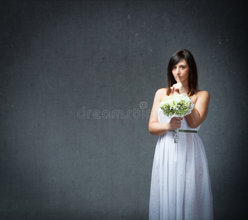 Silencio en un vestido de la boda foto de archivo Silencio en un vestido de la boda foto de archivo