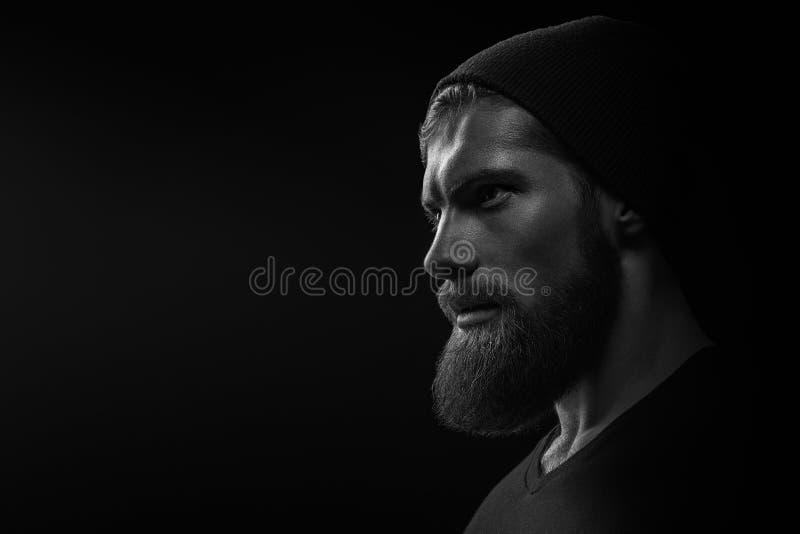Silhouet van een jonge, baardige hipster stock afbeeldingen