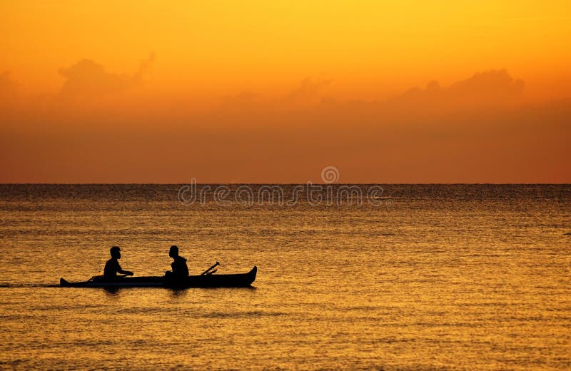 Two Fishermen boating at sunset. Two Fishermen boating at sunset