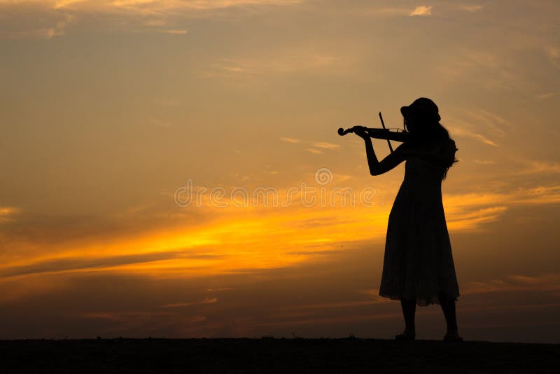 Silhouette of asian woman play violin