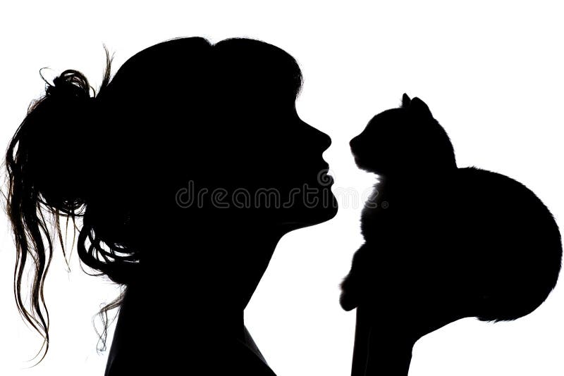 Silhouette of a beautiful woman with wavy hair that nose to nose with a small kitten in her arms, the concept of caring for animal