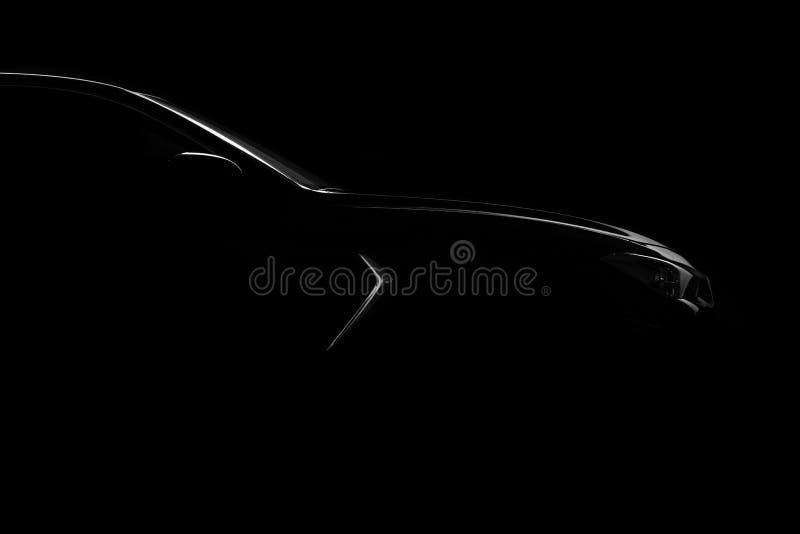 Four-door sport coupe. Silhouette of black sports car with headlights. Four-door sport coupe. Silhouette of black sports car with headlights