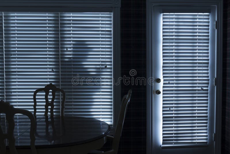 Silhouette of Burglar Sneeking Up To Backdoor At N