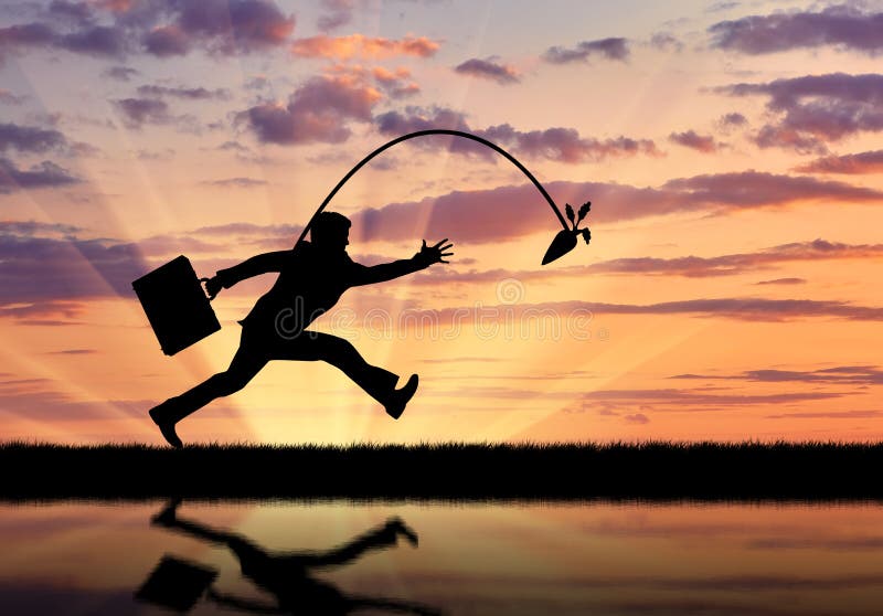 Silhouette of businessman running for the carrot and reflection in water.