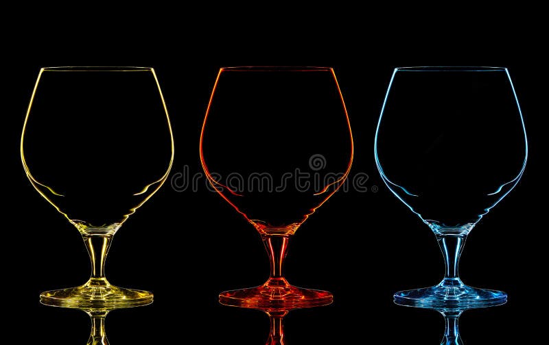 Silhouette of color whiskey glass on black