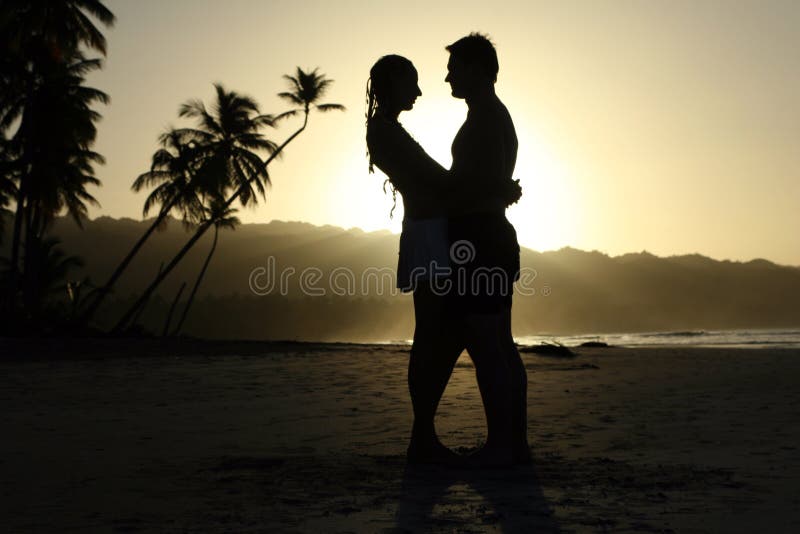 Silhouette couple at the beach