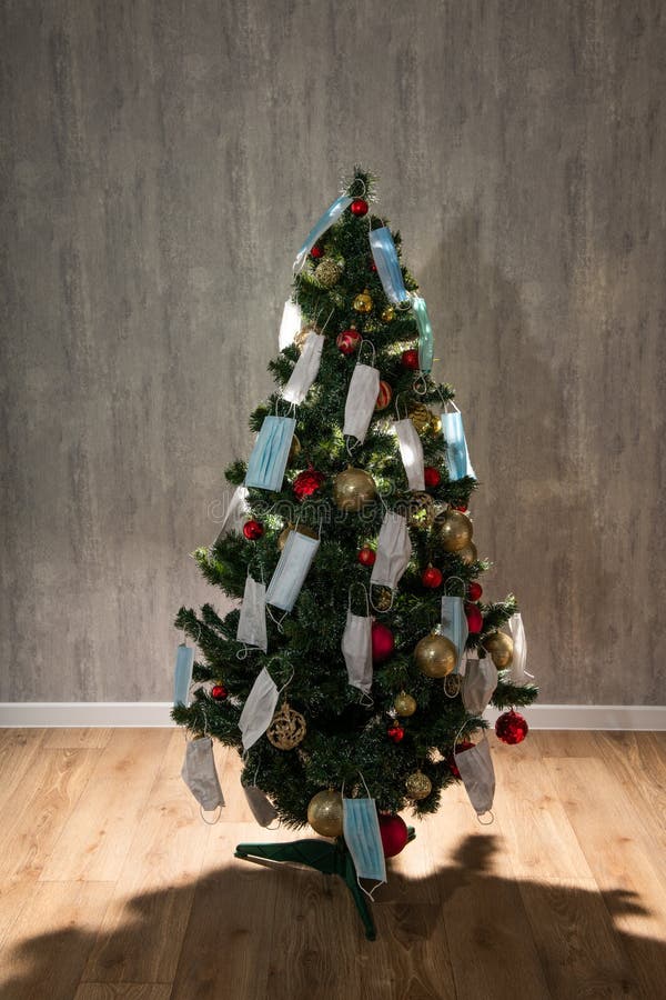 Silhouette of Decorated Christmas Tree with Protective Medical Masks