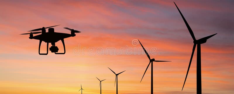 Silhouette of drone and wind turbines royalty free stock image