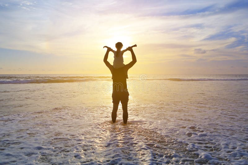 Silhouette father were riding neck carries daughter look out at the sea at sunset. Family enjoyed a holiday. Child stretch arm and stock photos Silhouette father were riding neck carries daughter look out at the sea at sunset. Family enjoyed a holiday. Child stretch arm and stock photos
