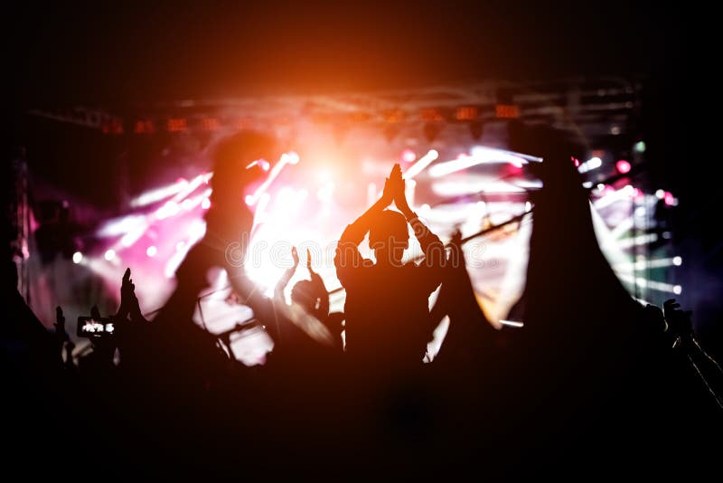 Silhouette of a Girl with Raised at a Concert Stock Photo - Image of ...