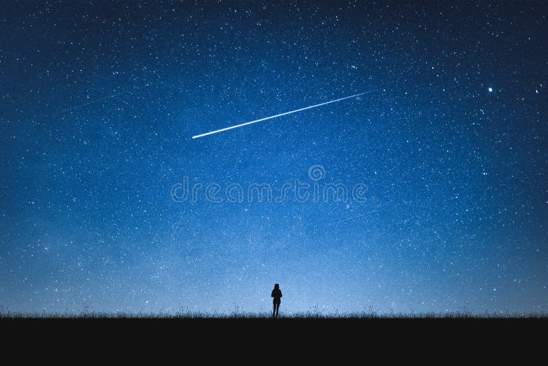 Silhouette of girl standing on mountain and night sky with shooting star. Alone concept