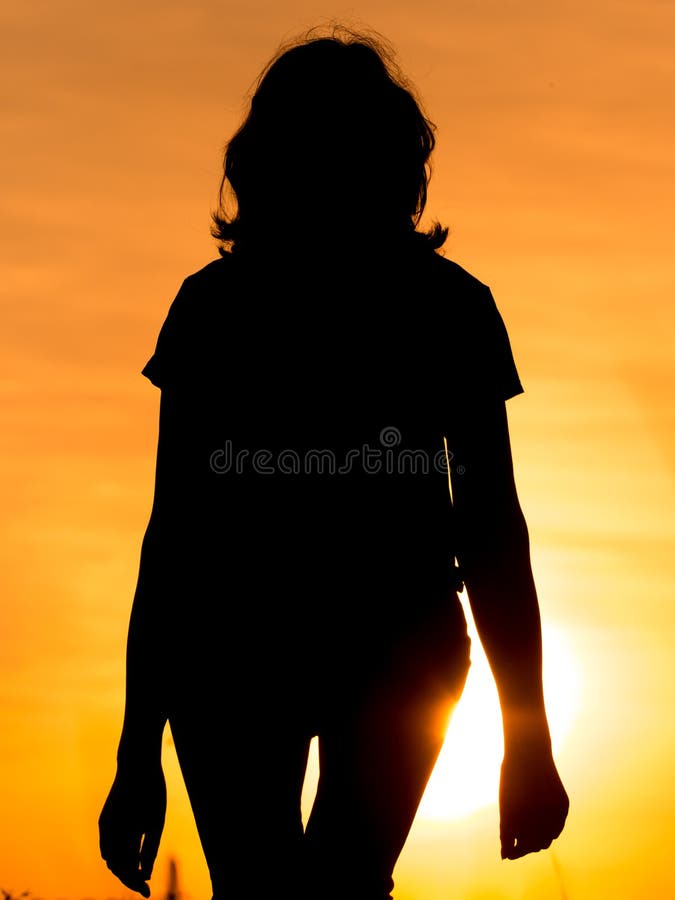 Silhouette of a girl in the sunset stock photography Silhouette of a girl in the sunset stock photography