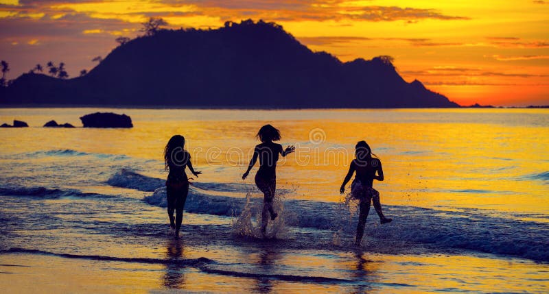 Silhouette of girls at sunset