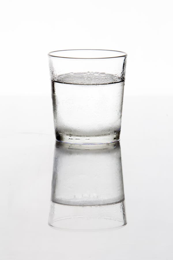 Silhouette of a glass of cold water stock photo