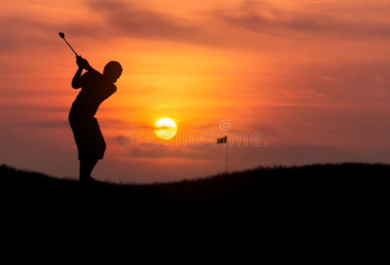 Silhouette golfer hitting golf ball in sunset