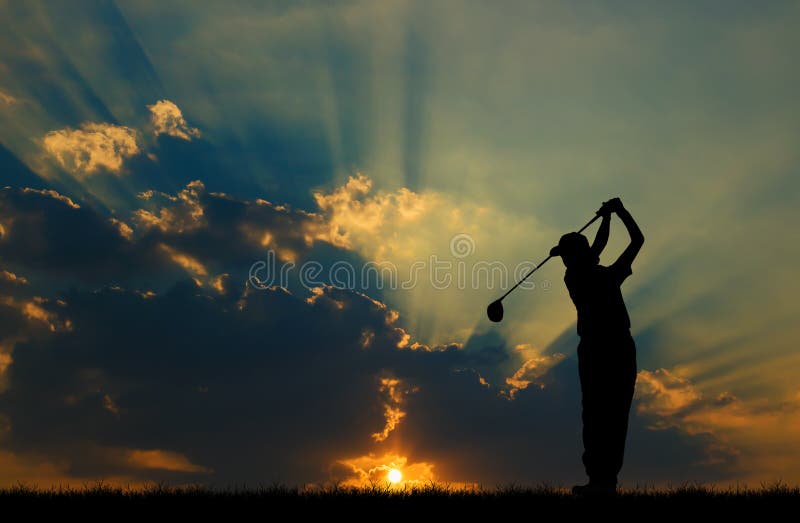 Silhouette golfer playing golf at beautiful sunset