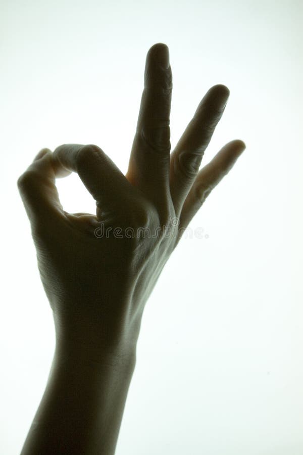 Silhouette hand showing ok sign