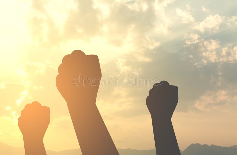 Silhouette hands fist with sun lighting