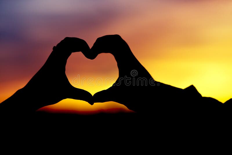Silhouette of hands heart shaped stock image Silhouette of hands heart shaped stock image