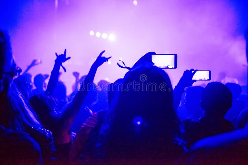 Raised Arms Holding Smart Phones To Recording a Live Concert Editorial ...