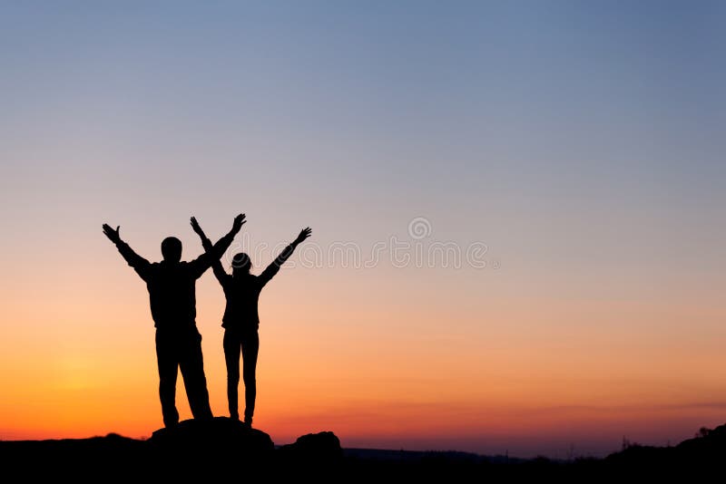 Silhouette of a happy family against the beautiful sky. Summer Sunset. Landscape