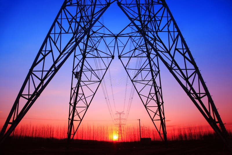 The silhouette of high voltage towers