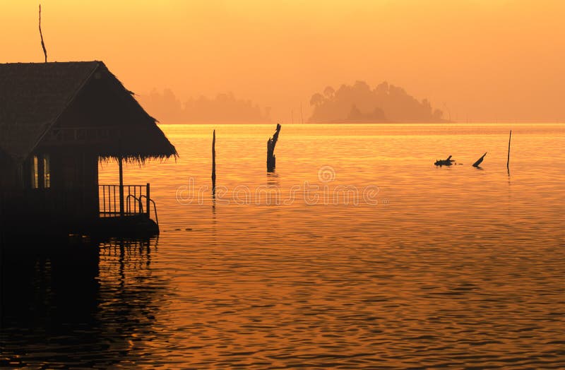 Silhouette home stay on lake stock photos Silhouette home stay on lake stock photos
