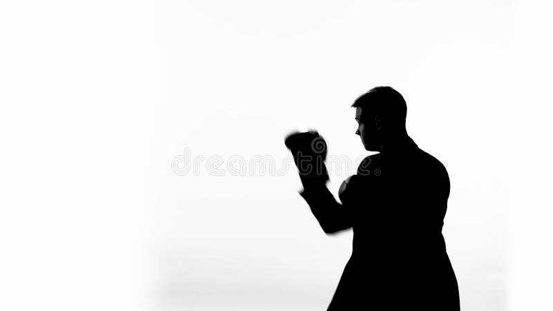 Silhouette of honest politician trying to fight corruption, shadow boxing