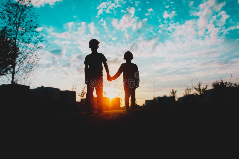 Silhouette Of Little Boy And Girl Holding Hands At Sunset Stock Image Image Of Playful Lifestyle