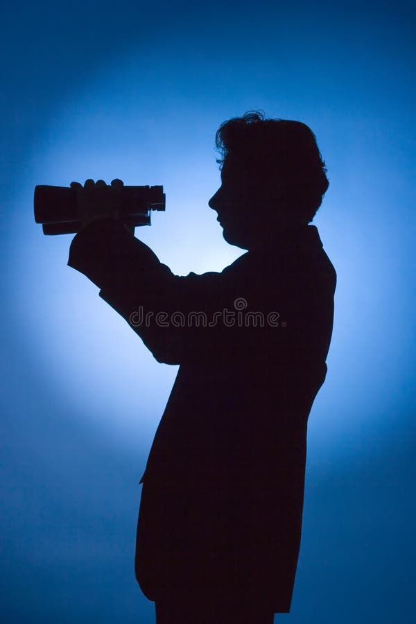 Silhouette of man with binoculars