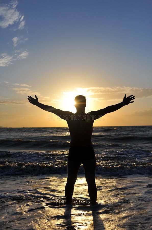 Silhouette of a man with outstretched arms