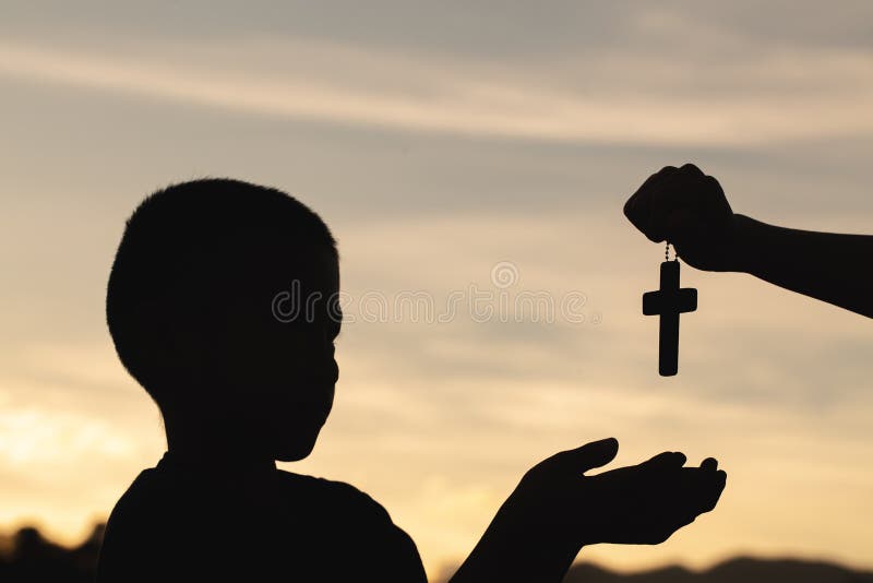 Silhouette Of A Man Praying With A Cross In Hand At Sunrise Religion