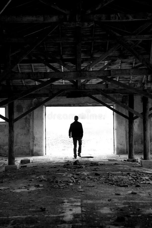 Silhouette man in ruined place