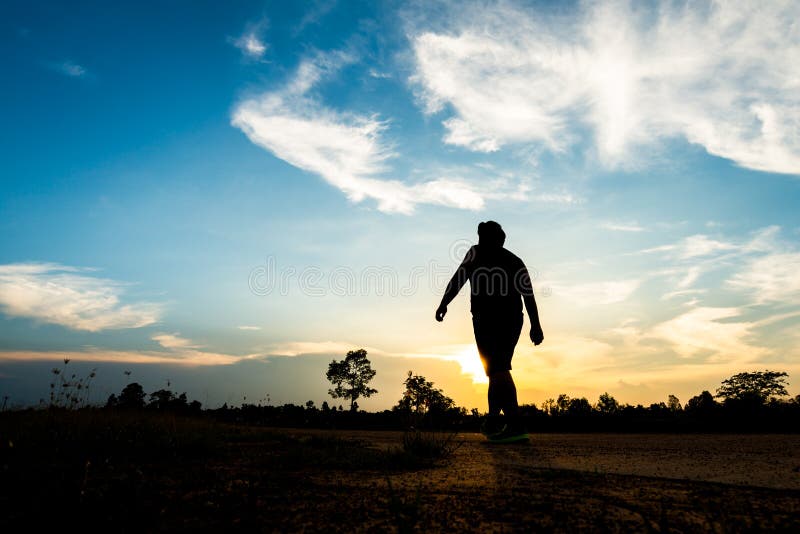 Silhouette Man Walking on the Sunset Background Stock Photo - Image of  training, black: 75784760