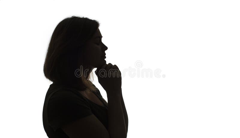 Silhouette med ung svart kvinna som tänker nåt. arkivfoton