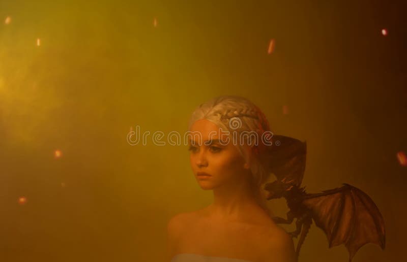 Silhouette of a mysterious woman in the ashes and in the smoke from the fire.