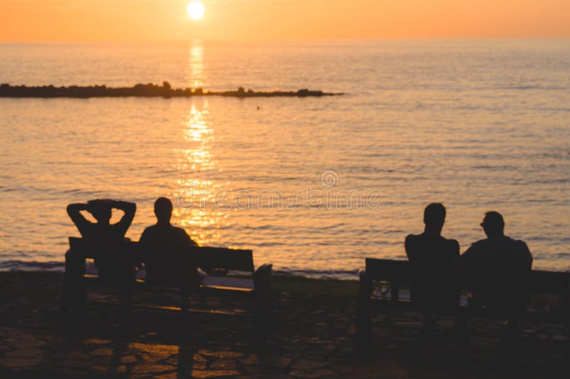 Silhouette of People Enjoying Sunset Stock Photo - Image of coast