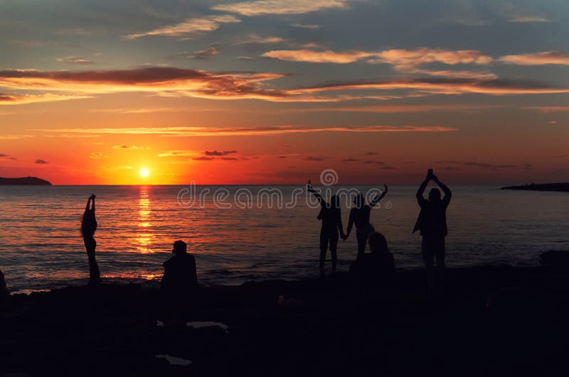 Silhouette of a people during the sunset at Cafe Del Mar. Ibiza Island. Balearic Islands. Spain