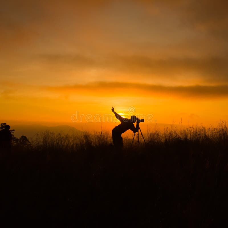 Silhouette of photographer taking picture