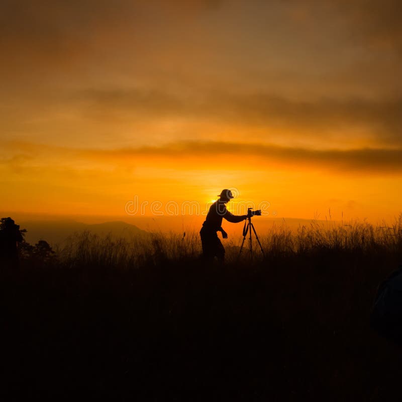 Silhouette of photographer taking picture