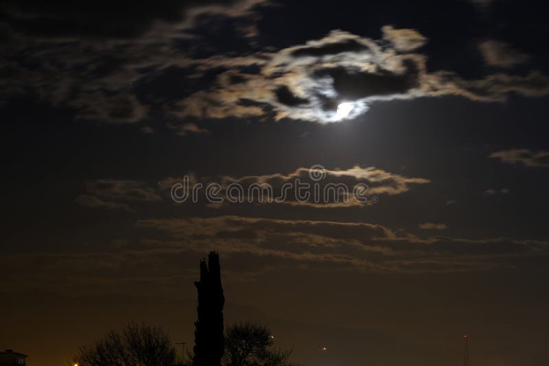 Clouds passing through full moon. Horror concept idea. stock photography