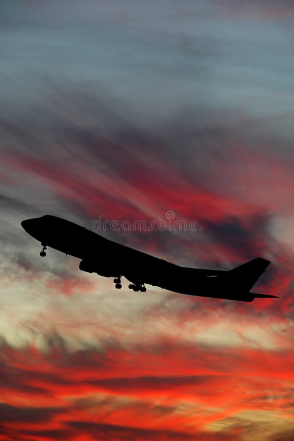 Silhouette of plane and sunset