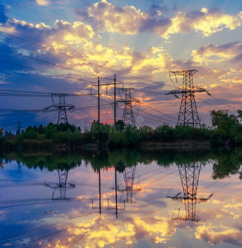 Silhouette power transmission tower during twilight time.