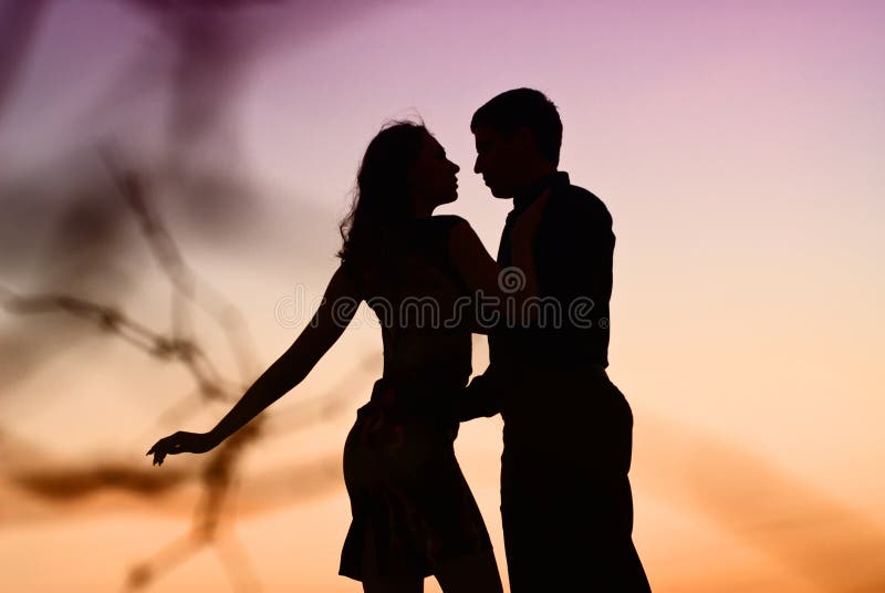 Silhouette at sunset lovers