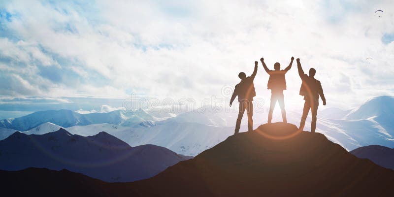 Silhouette of the team on the peak of mountain stock photos Silhouette of the team on the peak of mountain stock photos