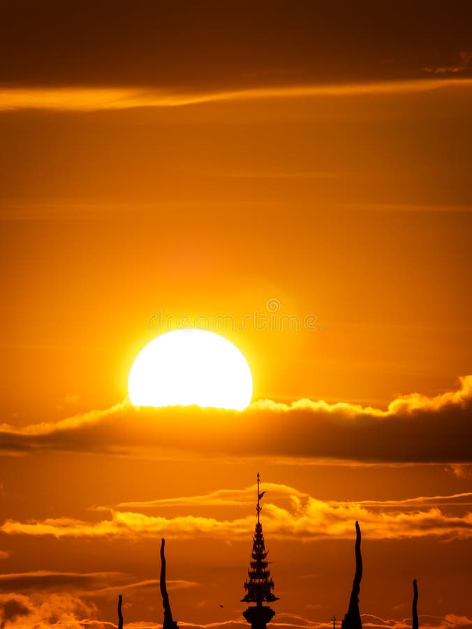 Silhouette of Top The Church behind The Sun Rise