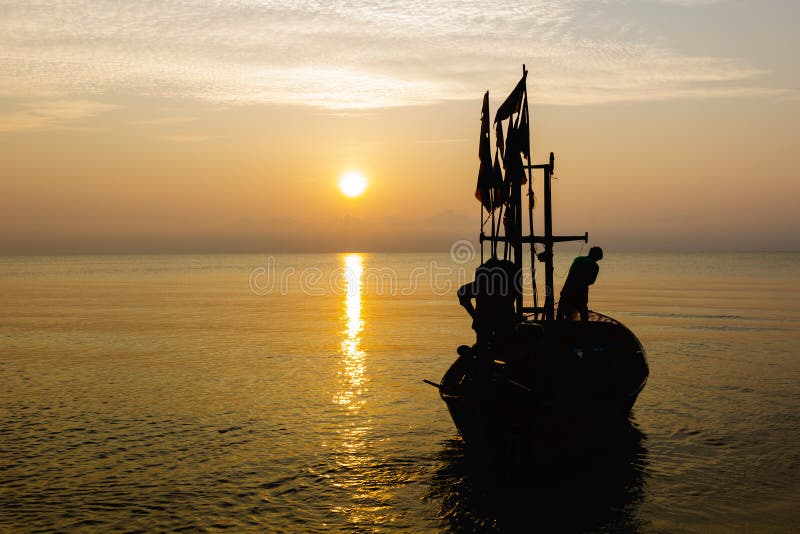 Silhouette of Two People on a Fishing Boat that is about To Go Fishing in  the Morning Sun.copy Space Stock Photo - Image of silhouette, commercial:  194655834