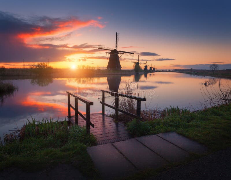 Silhouette of windmills at sunrise in Kinderdijk, Netherlands